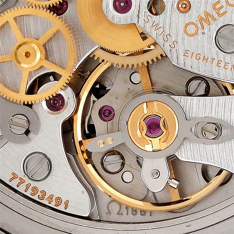 The image shows a close-up view of the intricate movement and inner workings of an Omega Speedmaster 3570.50.00 Men
s Stainless Steel Black Dial 3570.50.00 Men
s Stainless Steel Black Dial watch.