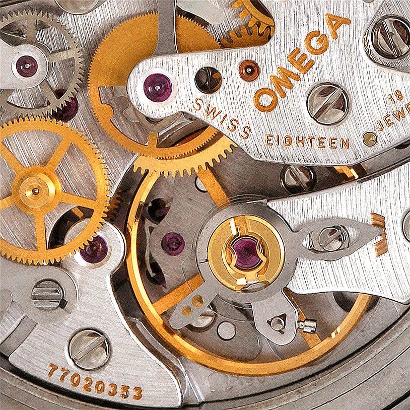 The image shows a close-up of the movement and internal gears of the Omega Speedmaster 3594.50.00 Men
s Stainless Steel Black Dial 3594.50.00 Men
s Stainless Steel Black Dial watch.