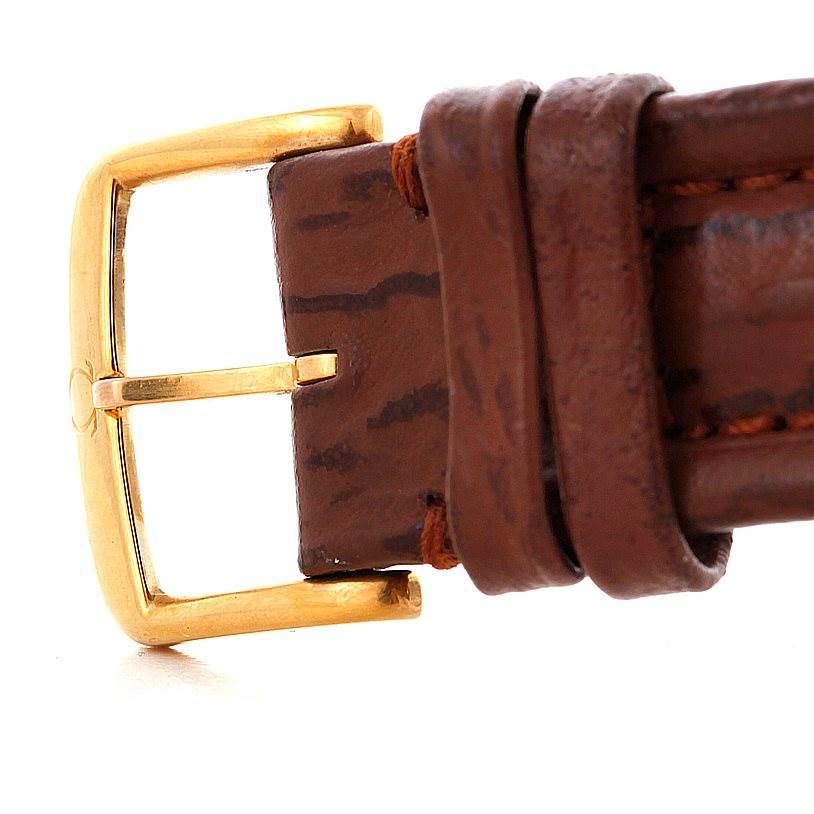 This image shows a close-up of the brown leather strap and gold buckle of the Omega Speedmaster 3716.50.00 Men
s Stainless Steel Black Dial 3716.50.00 Men
s Stainless Steel Black Dial watch.