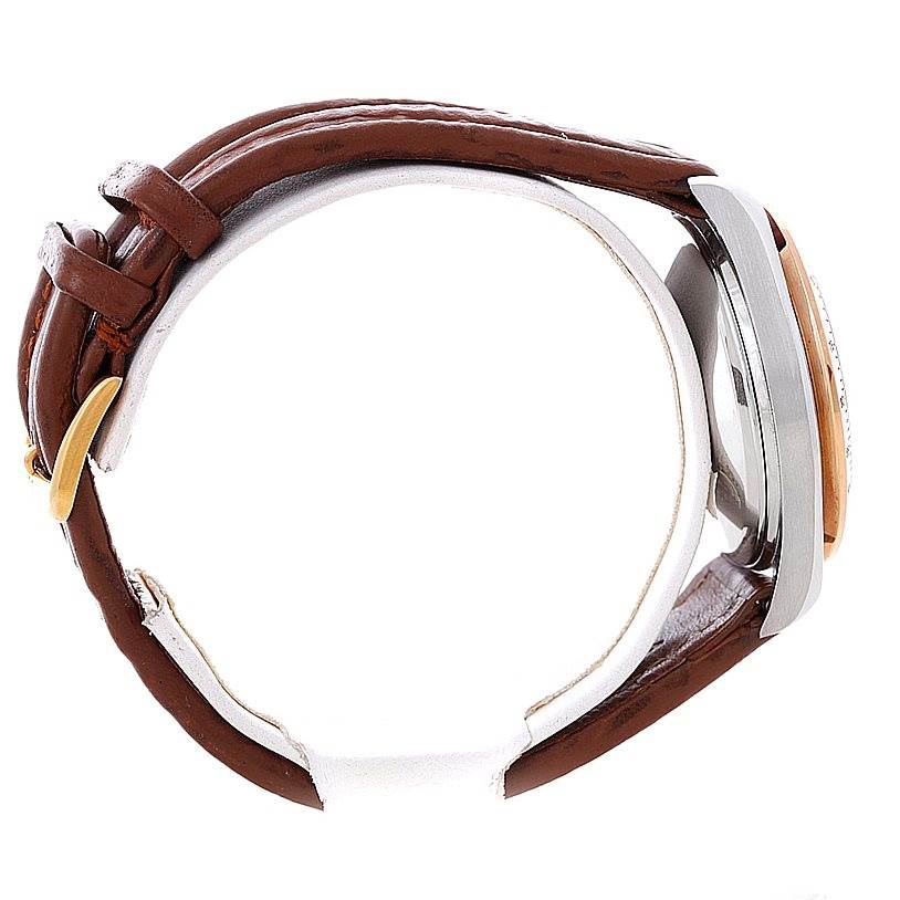 The image shows a side view of an Omega Speedmaster 3716.50.00 Men
s Stainless Steel Black Dial 3716.50.00 Men
s Stainless Steel Black Dial watch, highlighting its case, crown, and brown leather strap.