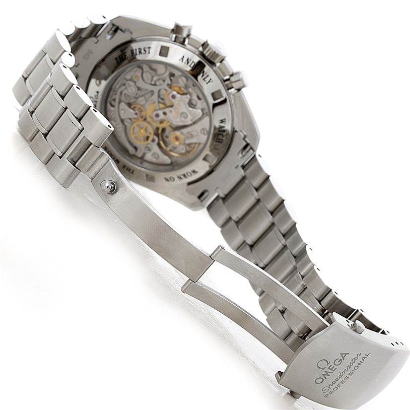 The image shows the back view of the Omega Speedmaster 311.30.42.30.13.001 Men's Stainless Steel Brown Dial 311.30.42.30.13.001 Men's Stainless Steel Brown Dial watch, highlighting its open case back and stainless steel bracelet.