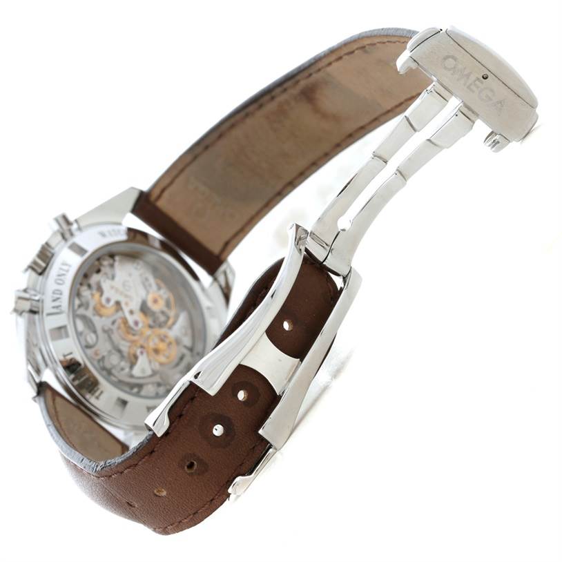 The image shows the back view of the Omega Speedmaster 311.32.42.30.13.001 Men's Stainless Steel Brown Dial 311.32.42.30.13.001 Men's Stainless Steel Brown Dial, highlighting its transparent case back, leather strap, and deployant clasp.