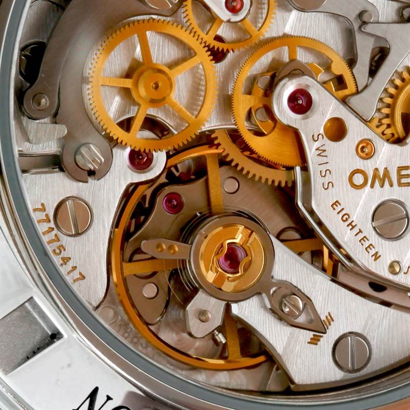 This close-up image showcases the intricate internal mechanics of an Omega Speedmaster 311.32.42.30.13.001 Men's Stainless Steel Brown Dial 311.32.42.30.13.001 Men's Stainless Steel Brown Dial watch from a macro perspective.