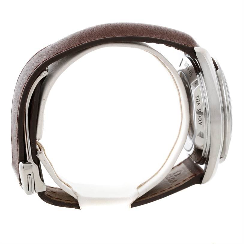 The image shows a side view of an Omega Speedmaster 311.32.42.30.13.001 Men's Stainless Steel Brown Dial 311.32.42.30.13.001 Men's Stainless Steel Brown Dial watch, highlighting its case back, brown leather strap, and clasp.