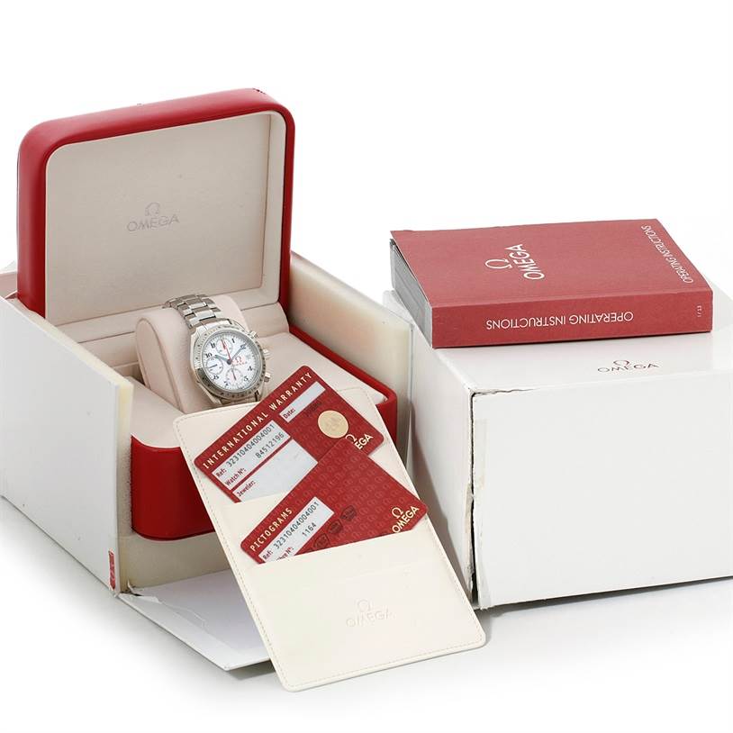 The Omega Speedmaster 323.10.40.40.04.001 Men
s Stainless Steel White Dial 323.10.40.40.04.001 Men
s Stainless Steel White Dial watch is displayed in its box, along with an instruction manual and warranty cards.