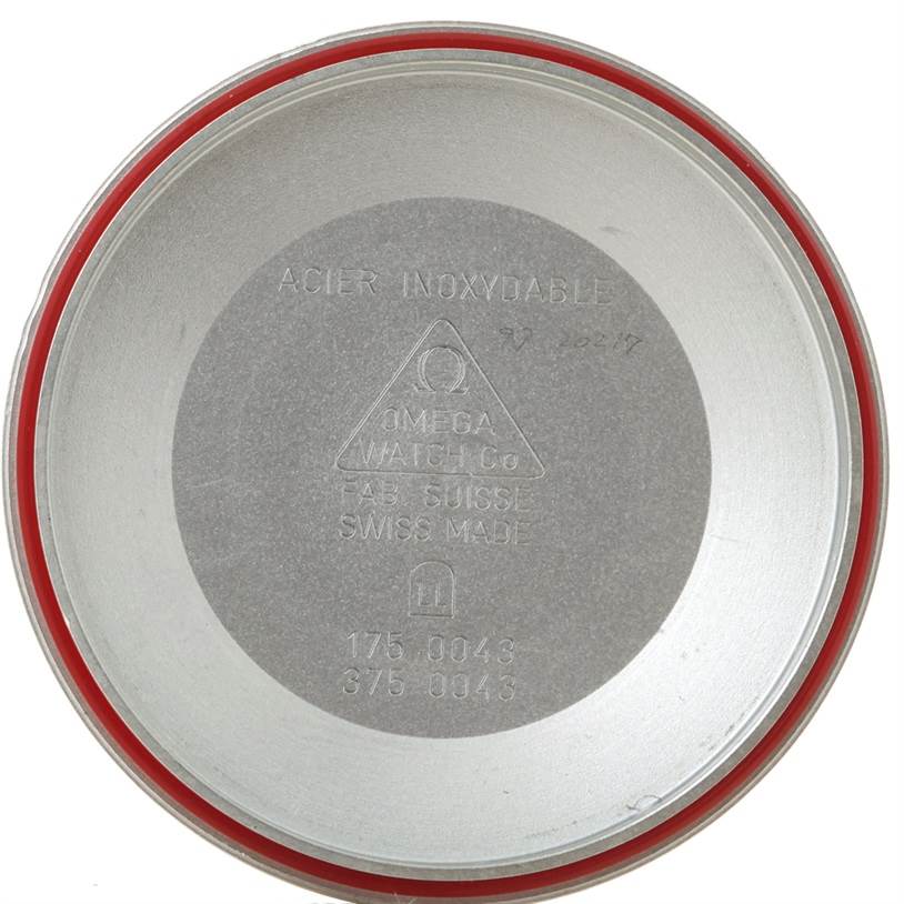 The image shows the inner case back of an Omega Speedmaster Men's Stainless Steel White Dial Men's Stainless Steel White Dial watch, displaying inscriptions and the brand logo.