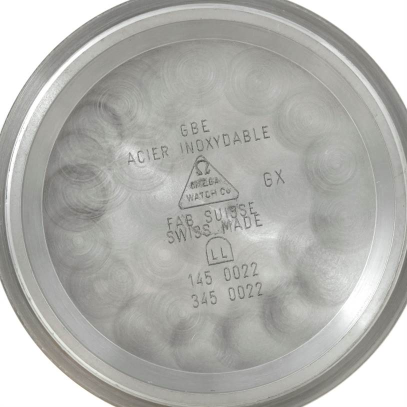 This image shows the stainless steel case back of an Omega Speedmaster 3597.17 Men
s Stainless Steel Black Dial 3597.17 Men
s Stainless Steel Black Dial watch, with engraved markings and the Omega logo.