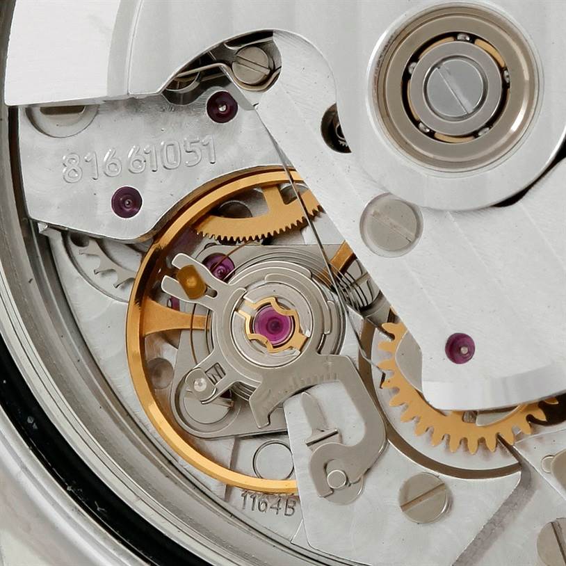 The image shows the movement mechanism of the Omega Speedmaster 3210.51.00 Men
s Stainless Steel Black Dial 3210.51.00 Men
s Stainless Steel Black Dial watch at a close-up angle, highlighting gears and components.