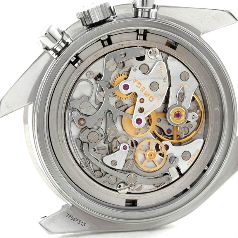 The image shows the intricate internal mechanical movement of the Omega Speedmaster 3575.20.00 Men
s Stainless Steel White Dial 3575.20.00 Men
s Stainless Steel White Dial watch from a back angle.