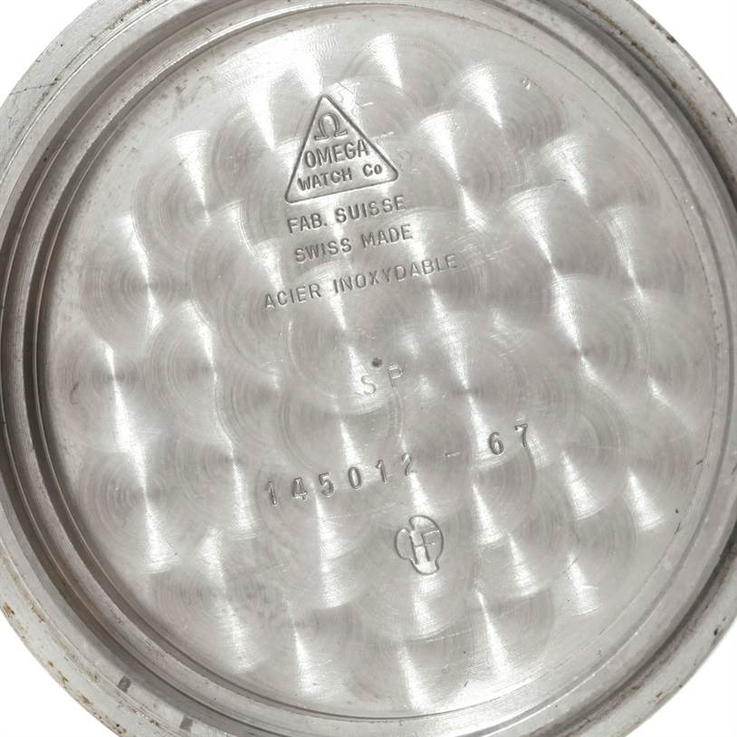 This image shows the inner case back of an Omega Speedmaster Men
s Stainless Steel Black Dial Men
s Stainless Steel Black Dial watch, displaying its model and manufacturing details.