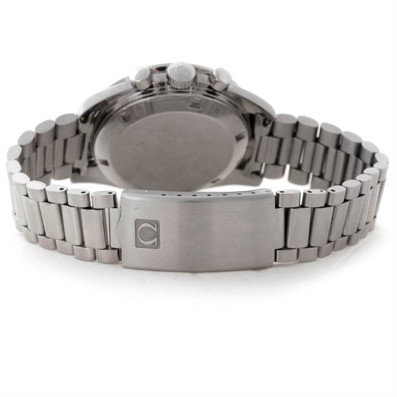 The image shows the backside of an Omega Speedmaster Men
s Stainless Steel Black Dial Men
s Stainless Steel Black Dial watch, focusing on the clasp and bracelet.