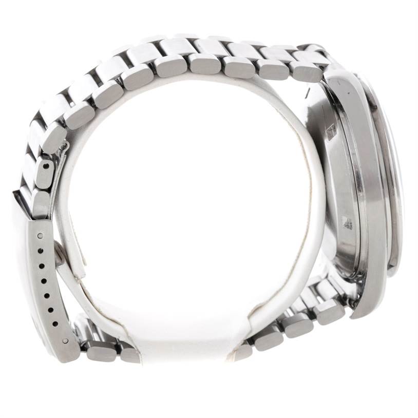 The image shows a side view of an Omega Speedmaster Men
s Stainless Steel Black Dial Men
s Stainless Steel Black Dial watch, highlighting its stainless steel bracelet and case.