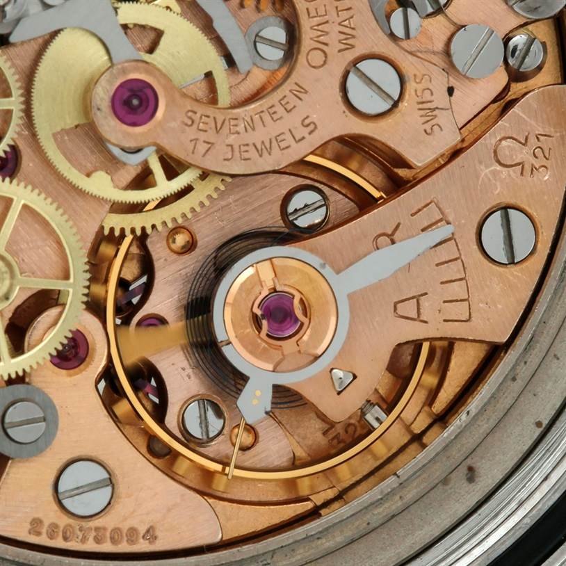 This image shows a close-up view of the Omega Speedmaster Men
s Stainless Steel Black Dial Men
s Stainless Steel Black Dial
s intricate 321 movement mechanism.