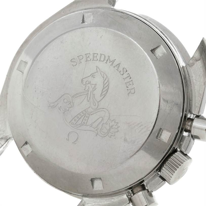 The image shows the case back of an Omega Speedmaster Men
s Stainless Steel Black Dial Men
s Stainless Steel Black Dial, featuring its emblem and part of the crown and pushers.