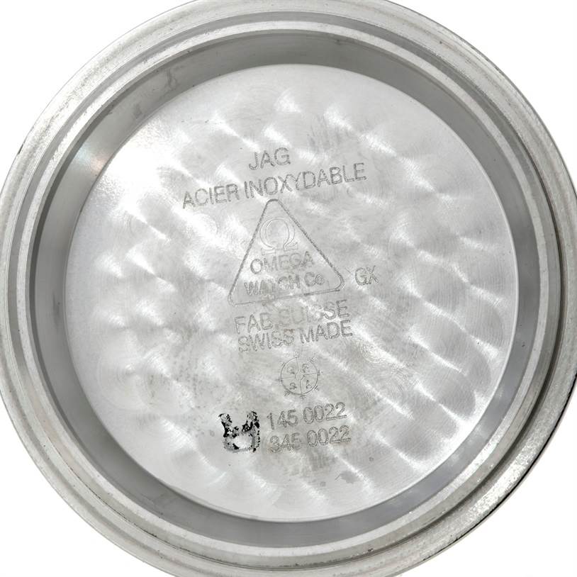 This image shows the inner side of the case back of an Omega Speedmaster 3570.50.00 Men
s Stainless Steel Black Dial 3570.50.00 Men
s Stainless Steel Black Dial watch, highlighting engraved details.