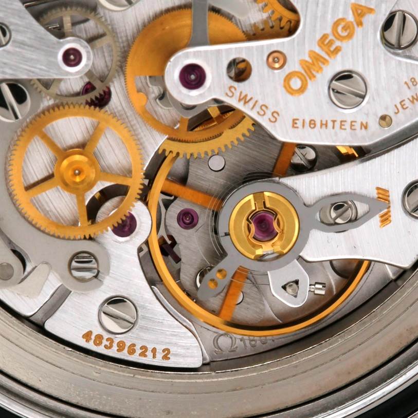 Close-up of the internal mechanism of an Omega Speedmaster 3570.50.00 Men
s Stainless Steel Black Dial 3570.50.00 Men
s Stainless Steel Black Dial watch, showcasing gears and intricate components.