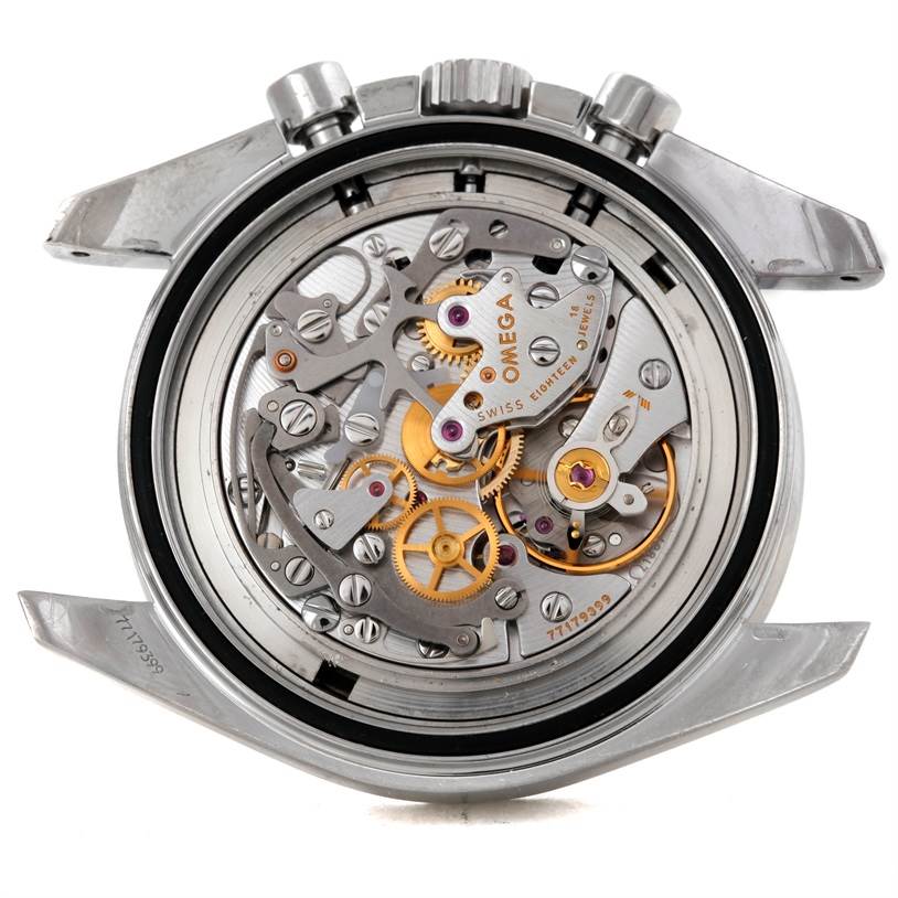 The image shows the open back of an Omega Speedmaster 3570.50.00 Men
s Stainless Steel Black Dial 3570.50.00 Men
s Stainless Steel Black Dial, displaying its intricate inner mechanical movement.