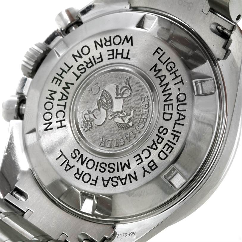 This image shows the back case of an Omega Speedmaster 3570.50.00 Men
s Stainless Steel Black Dial 3570.50.00 Men
s Stainless Steel Black Dial watch, highlighting its engravings and metal bracelet.