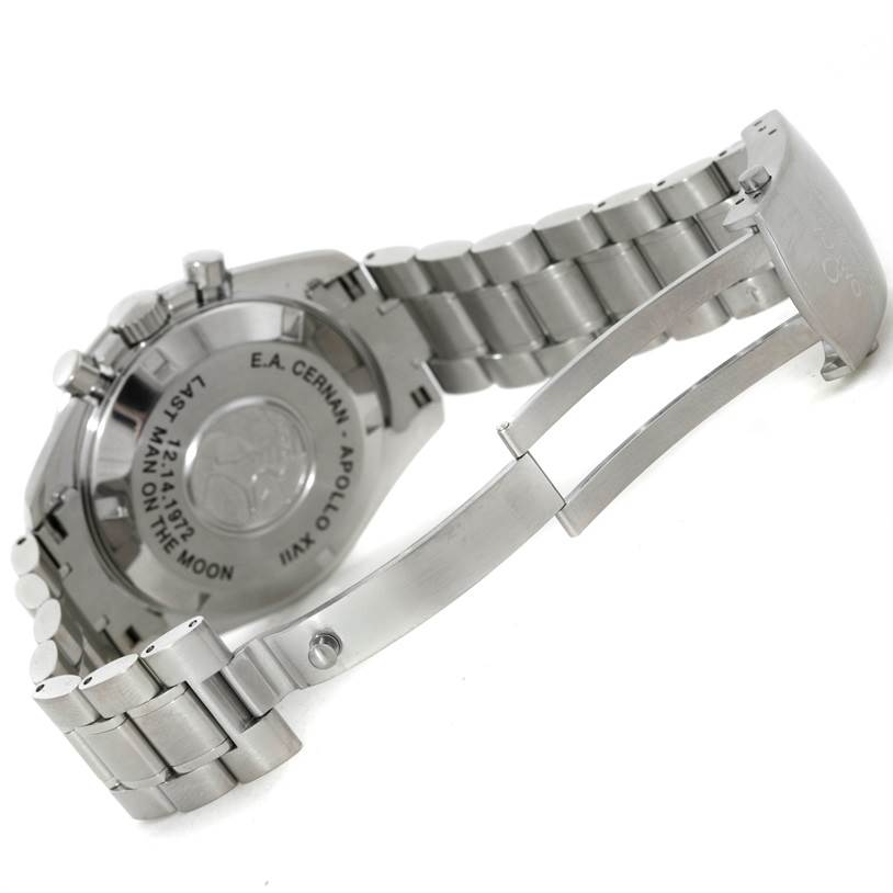 The image shows the back and partially open clasp of an Omega Speedmaster 3574.51.00 Men's Stainless Steel Black Dial 3574.51.00 Men's Stainless Steel Black Dial watch, highlighting the engraved details.