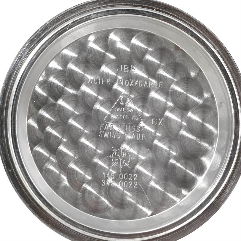 This image shows the inside of the case back of an Omega Speedmaster 3570.50.00 Men's Stainless Steel Black Dial 3570.50.00 Men's Stainless Steel Black Dial watch, displaying its brand engravings and model numbers.