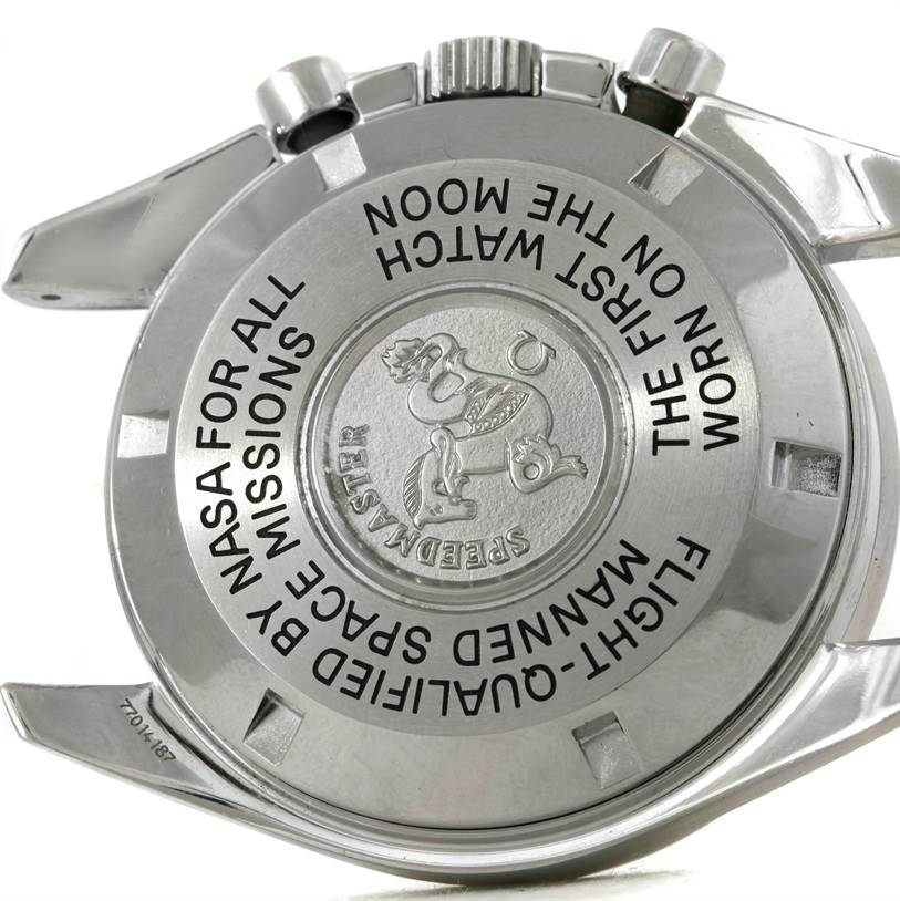 This image shows the back case of an Omega Speedmaster 3570.50.00 Men's Stainless Steel Black Dial 3570.50.00 Men's Stainless Steel Black Dial watch, highlighting its engravings and crown.