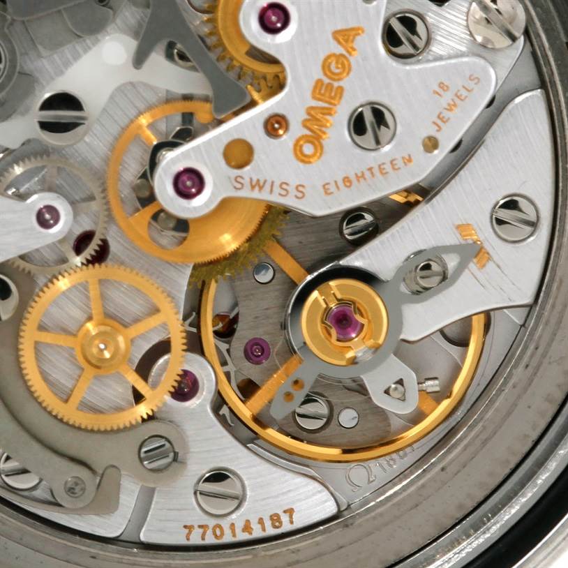 This image shows a close-up view of the Omega Speedmaster 3570.50.00 Men's Stainless Steel Black Dial 3570.50.00 Men's Stainless Steel Black Dial's intricate movement and gears, highlighting its craftsmanship.