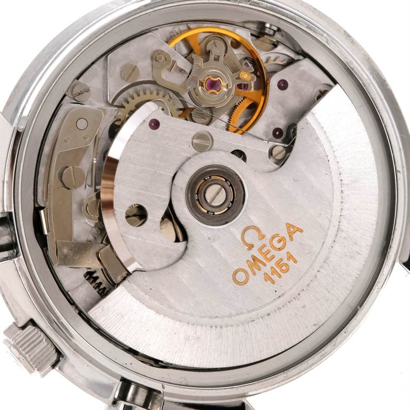 The image shows the movement mechanism and internal components of an Omega Speedmaster 3523.30.00 Men
s Stainless Steel Silver Dial 3523.30.00 Men
s Stainless Steel Silver Dial watch from a rear angle.