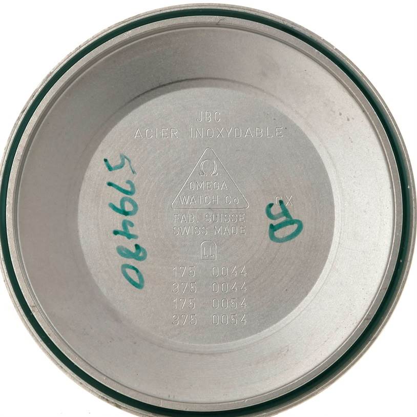 The image shows the inside case back of an Omega Speedmaster 3523.30.00 Men
s Stainless Steel Silver Dial 3523.30.00 Men
s Stainless Steel Silver Dial watch, displaying various model and manufacturing details.