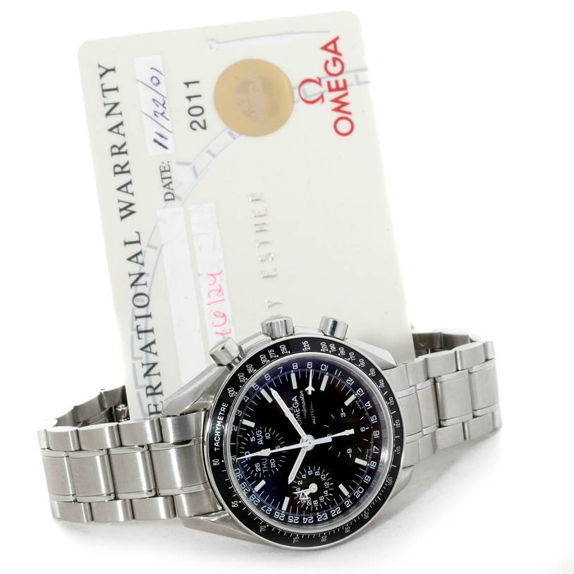 The image shows an Omega Speedmaster 3520.50.00 Men
s Stainless Steel Black Dial 3520.50.00 Men
s Stainless Steel Black Dial watch displayed with its International Warranty card.