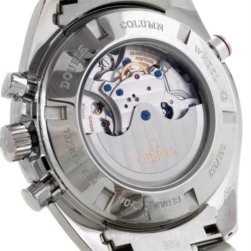 The image shows the back of the Omega Speedmaster 311.30.44.51.01.001 Men's Stainless Steel Black Dial 311.30.44.51.01.001 Men's Stainless Steel Black Dial watch, highlighting its exposed movement and engravings.