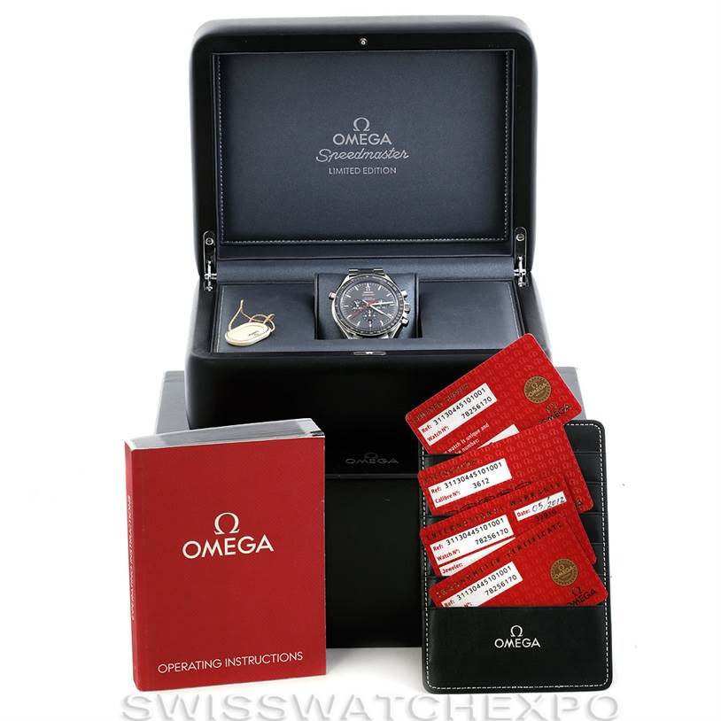 The Omega Speedmaster 311.30.44.51.01.001 Men's Stainless Steel Black Dial 311.30.44.51.01.001 Men's Stainless Steel Black Dial watch is shown in its open box with operating instructions, warranty cards, and other accessories.
