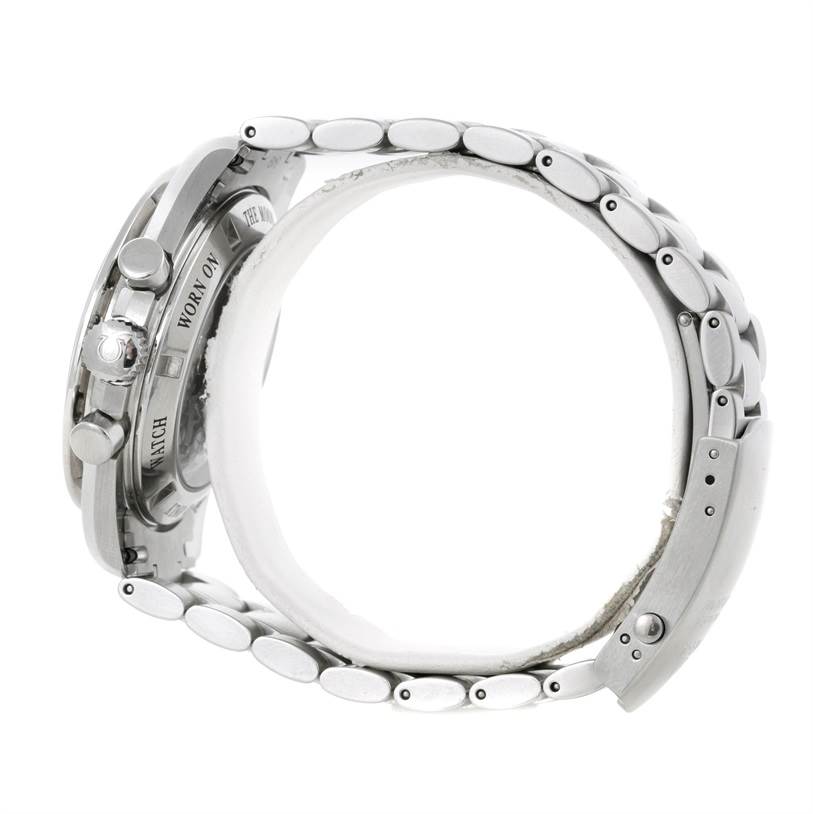 The image shows a side view of an Omega Speedmaster 3573.50.00 Men
s Stainless Steel Black Dial 3573.50.00 Men
s Stainless Steel Black Dial watch, highlighting its crown, pushers, and metal bracelet.