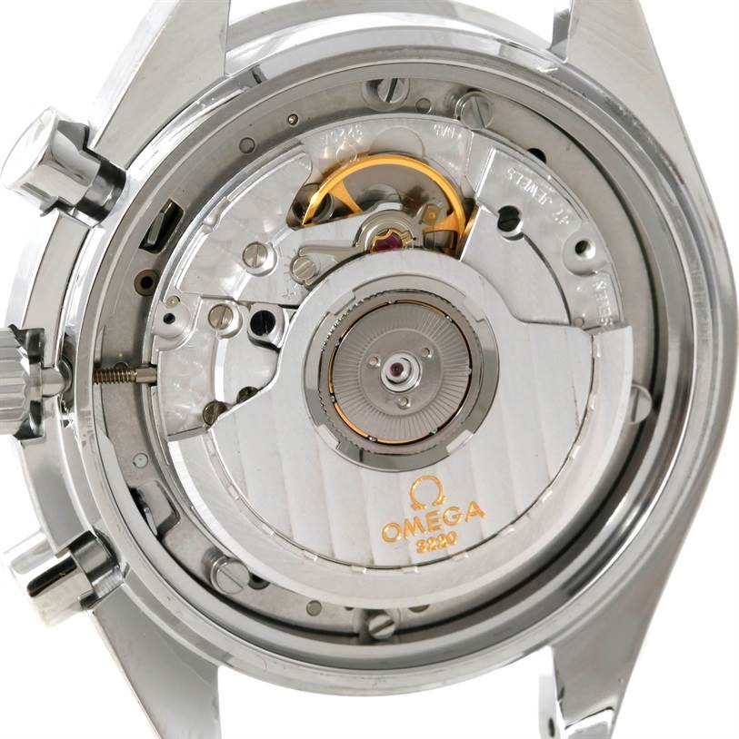 The image shows the back view of an Omega Speedmaster 3510.50.00 Men
s Stainless Steel Black Dial 3510.50.00 Men
s Stainless Steel Black Dial watch, highlighting its inner mechanical movement and rotor.