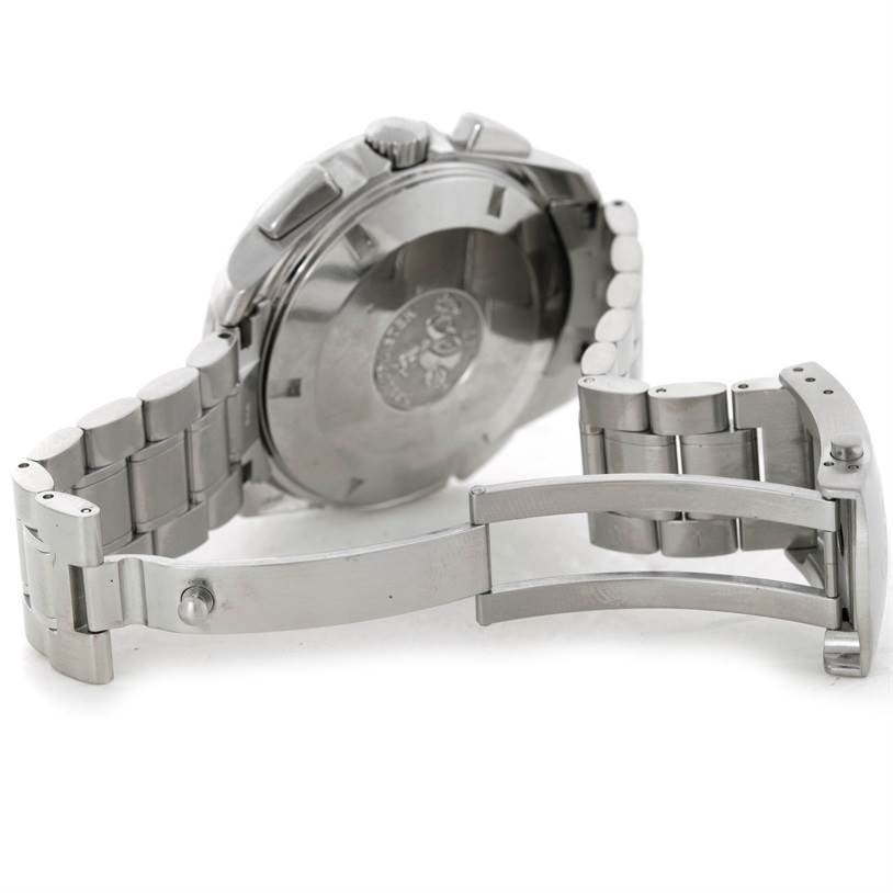 The image shows the backside of an Omega Speedmaster 3540.50.00 Men's Stainless Steel Black Dial 3540.50.00 Men's Stainless Steel Black Dial watch, focusing on the case back and partially opened metal bracelet.