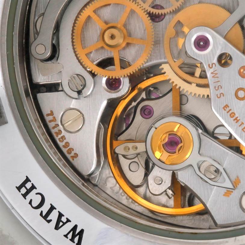 The image shows a close-up of the movement mechanism inside the Omega Speedmaster 3576.50.00 Men
s Stainless Steel Black Dial 3576.50.00 Men
s Stainless Steel Black Dial watch.