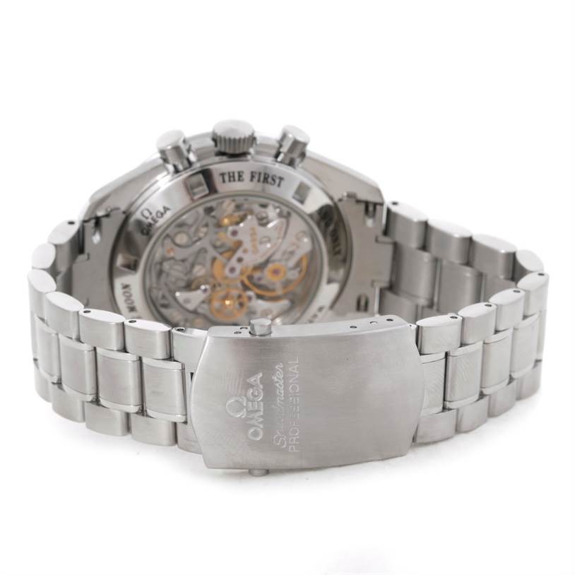 The image shows the back and the clasp of an Omega Speedmaster 3576.50.00 Men
s Stainless Steel Black Dial 3576.50.00 Men
s Stainless Steel Black Dial watch, highlighting the transparent case back and metal bracelet.