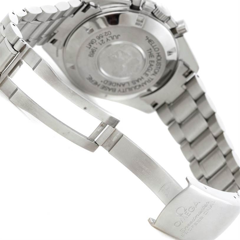 The image shows the back and partially open clasp of an Omega Speedmaster 3560.50.00 Men's Stainless Steel Black Dial 3560.50.00 Men's Stainless Steel Black Dial watch, displaying its case back and bracelet.