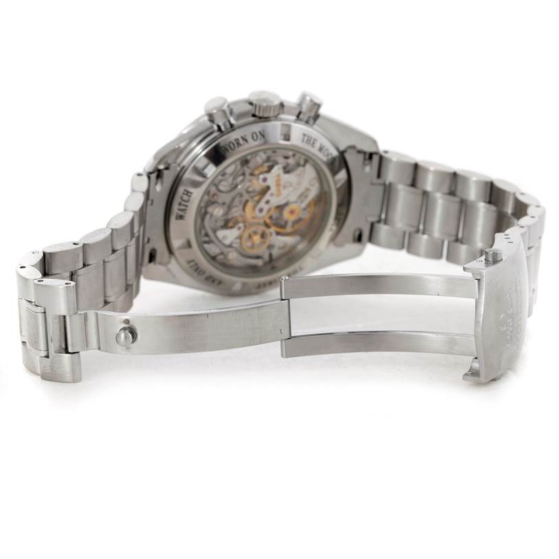 The image shows the back and bracelet of an Omega Speedmaster 3573.50.00 Men
s Stainless Steel Black Dial 3573.50.00 Men
s Stainless Steel Black Dial watch, highlighting its deployment clasp and transparent case back.