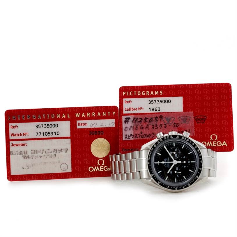 The image shows an Omega Speedmaster 3573.50.00 Men
s Stainless Steel Black Dial 3573.50.00 Men
s Stainless Steel Black Dial watch and its warranty cards from a front angle.