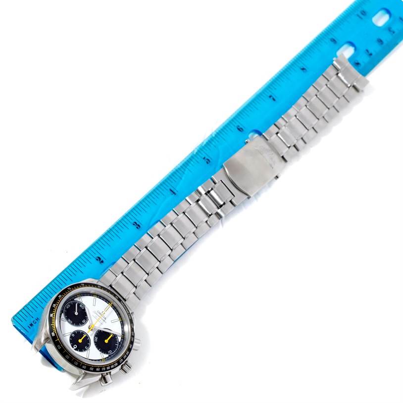 This image shows an Omega Speedmaster 326.30.40.50.04.001 Men
s Stainless Steel White Dial 326.30.40.50.04.001 Men
s Stainless Steel White Dial watch laid flat with its metal band next to a blue ruler for scale.