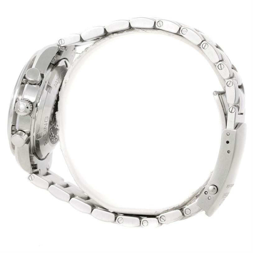 The image shows a side view of an Omega Speedmaster 326.30.40.50.04.001 Men
s Stainless Steel White Dial 326.30.40.50.04.001 Men
s Stainless Steel White Dial watch focusing on the bracelet, clasp, and side profile of the case and pushers.