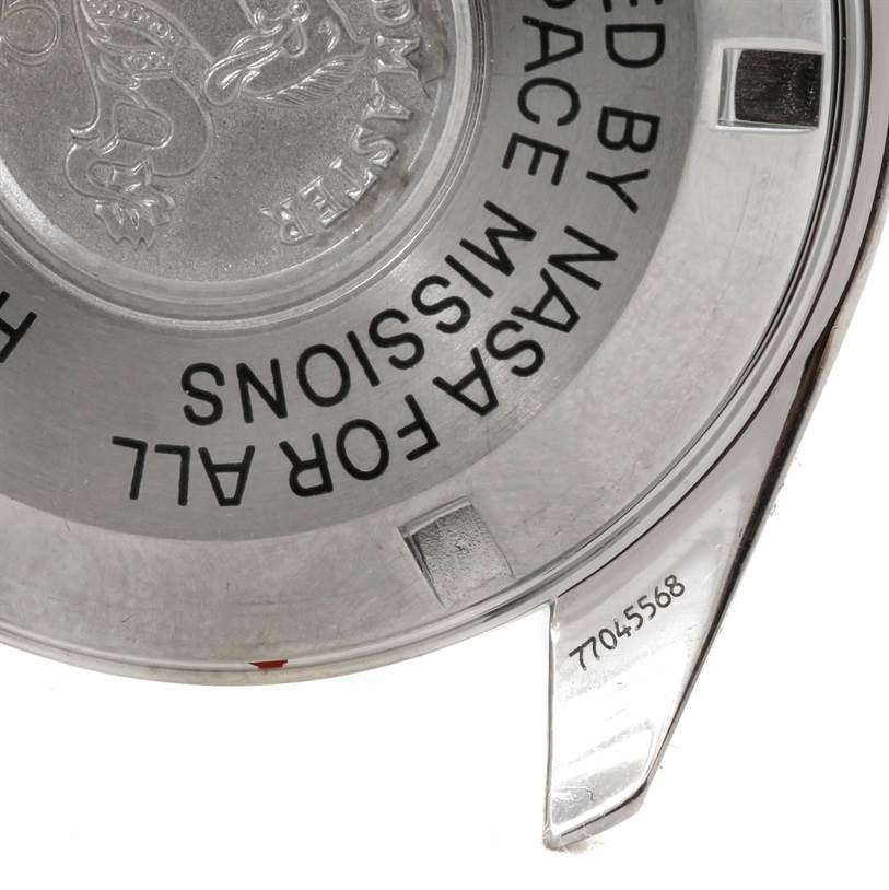 This image shows the case back of an Omega Speedmaster 3570.50.00 Men
s Stainless Steel Black Dial 3570.50.00 Men
s Stainless Steel Black Dial watch, featuring part of its engraved text and serial number.