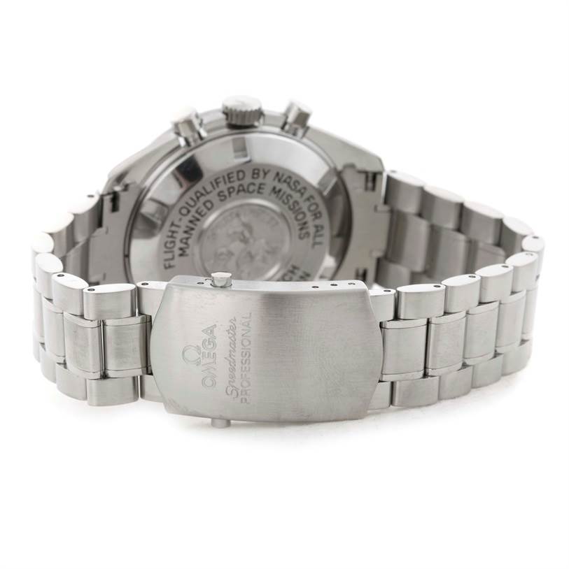 The image shows the back side and clasp of an Omega Speedmaster 3570.50.00 Men
s Stainless Steel Black Dial 3570.50.00 Men
s Stainless Steel Black Dial watch, displaying the engraving on both parts.