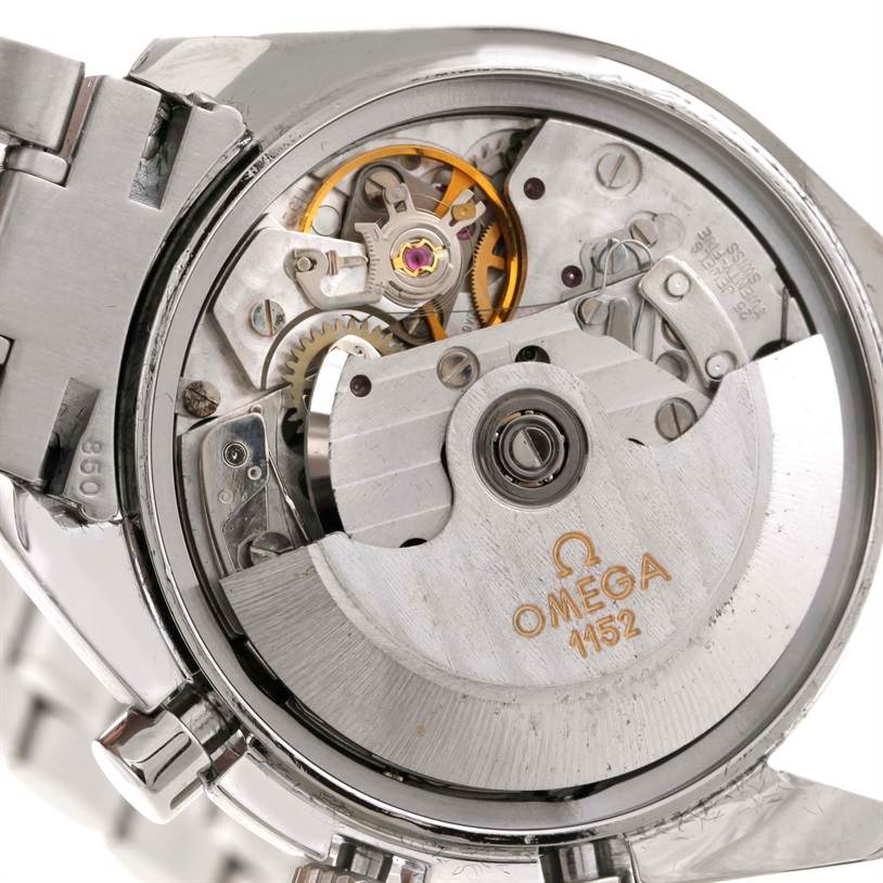 The image shows a close-up view of the movement mechanism of an Omega Speedmaster 3513.50.00 Men
s Stainless Steel Black Dial 3513.50.00 Men
s Stainless Steel Black Dial watch, highlighting its intricate internal components.