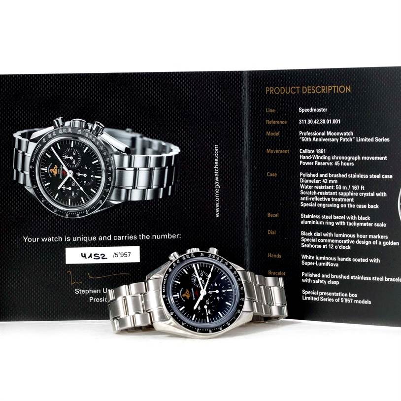 The image shows an Omega Speedmaster 311.30.42.30.01.001 Men
s Stainless Steel Black Dial 311.30.42.30.01.001 Men
s Stainless Steel Black Dial watch from a front angle, along with its product description and booklet.