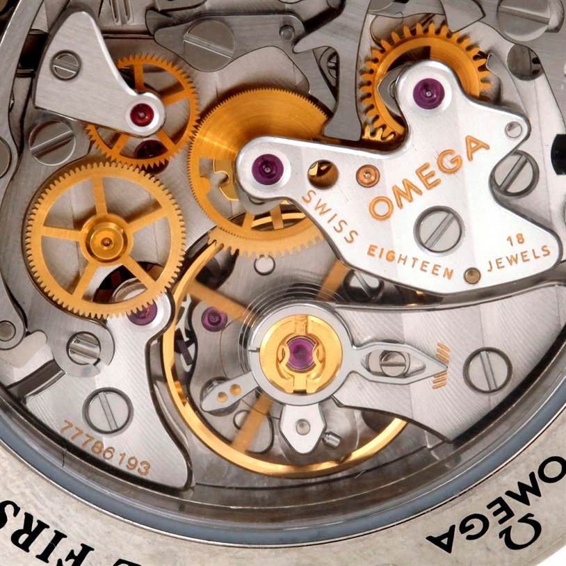 This image shows a close-up of the Omega Speedmaster 3573.50.00 Men
s Stainless Steel Black Dial 3573.50.00 Men
s Stainless Steel Black Dial
s intricate watch movement and internal gears.