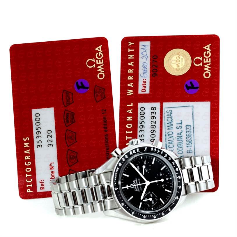 The image shows an Omega Speedmaster 3539.50.00 Men
s Stainless Steel Black Dial 3539.50.00 Men
s Stainless Steel Black Dial watch with its stainless steel band, and two warranty cards in the background.