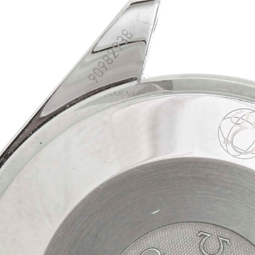 The image shows a close-up of the Omega Speedmaster 3539.50.00 Men
s Stainless Steel Black Dial 3539.50.00 Men
s Stainless Steel Black Dial
s back case and a part of the strap attachment.