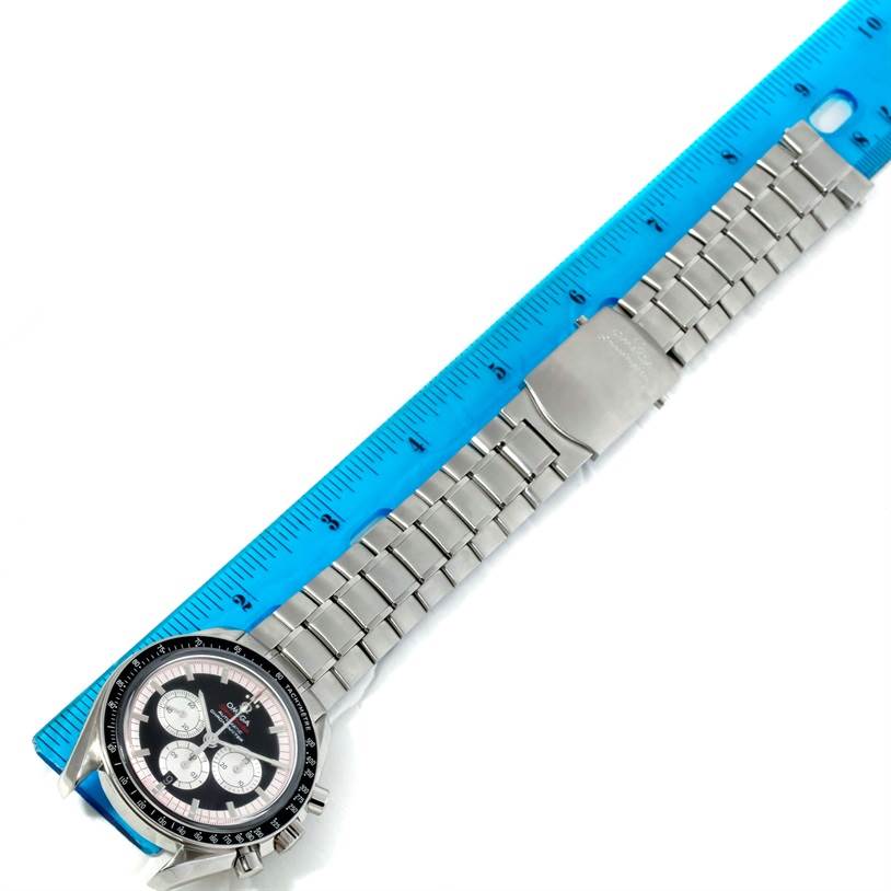 The image shows the Omega Speedmaster 3507.51.00 Men
s Stainless Steel Black Dial 3507.51.00 Men
s Stainless Steel Black Dial watch laid flat next to a ruler, displaying the watch face and entire metal bracelet from an overhead angle.