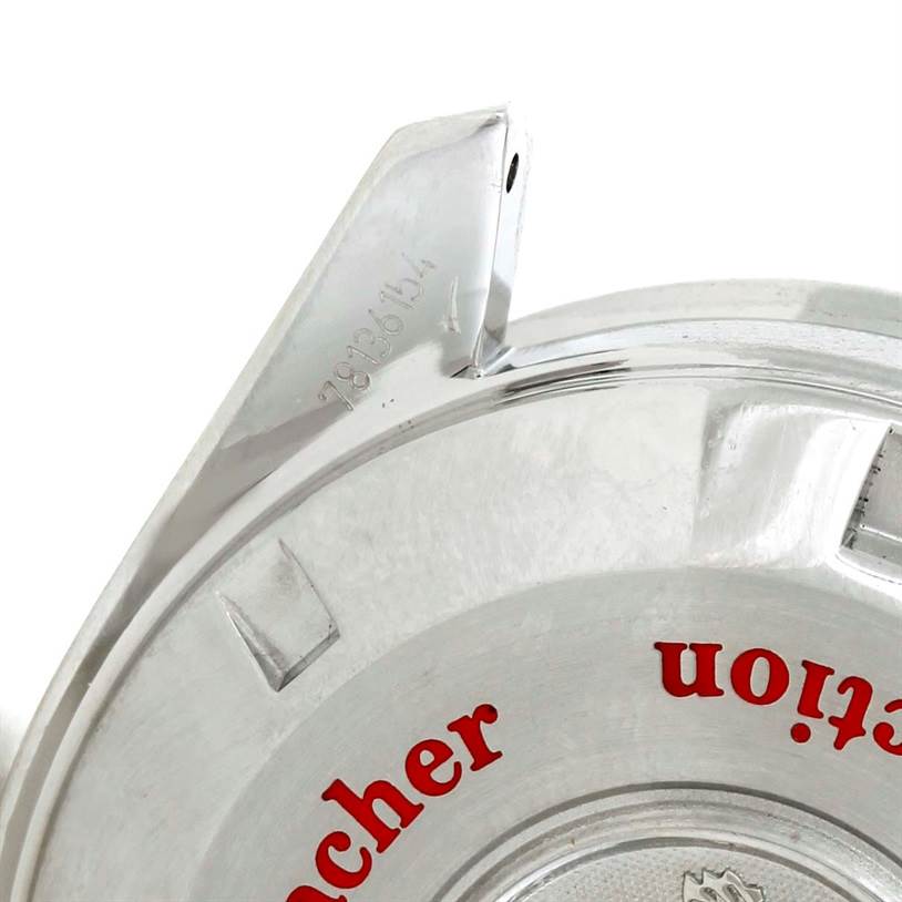 This image shows a partial view of the case back of an Omega Speedmaster 3507.51.00 Men
s Stainless Steel Black Dial 3507.51.00 Men
s Stainless Steel Black Dial watch with some inscription and a part of the lug.